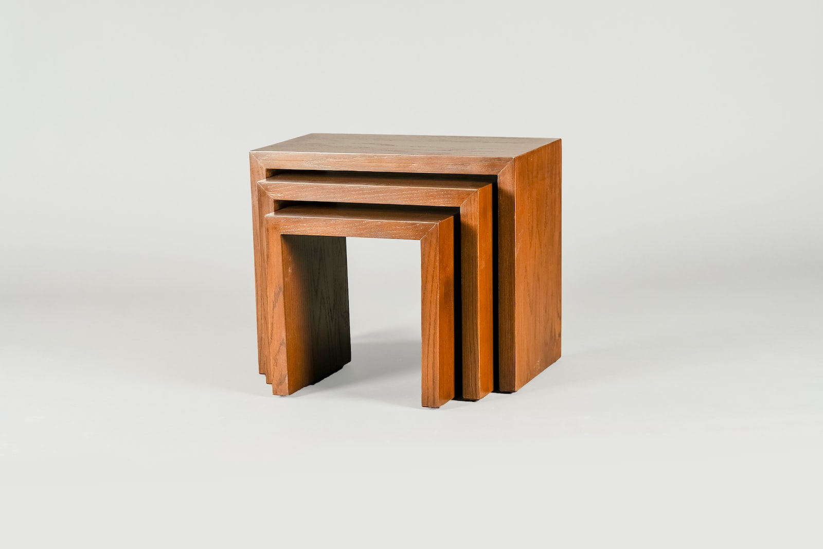 brown wooden table on gray floor